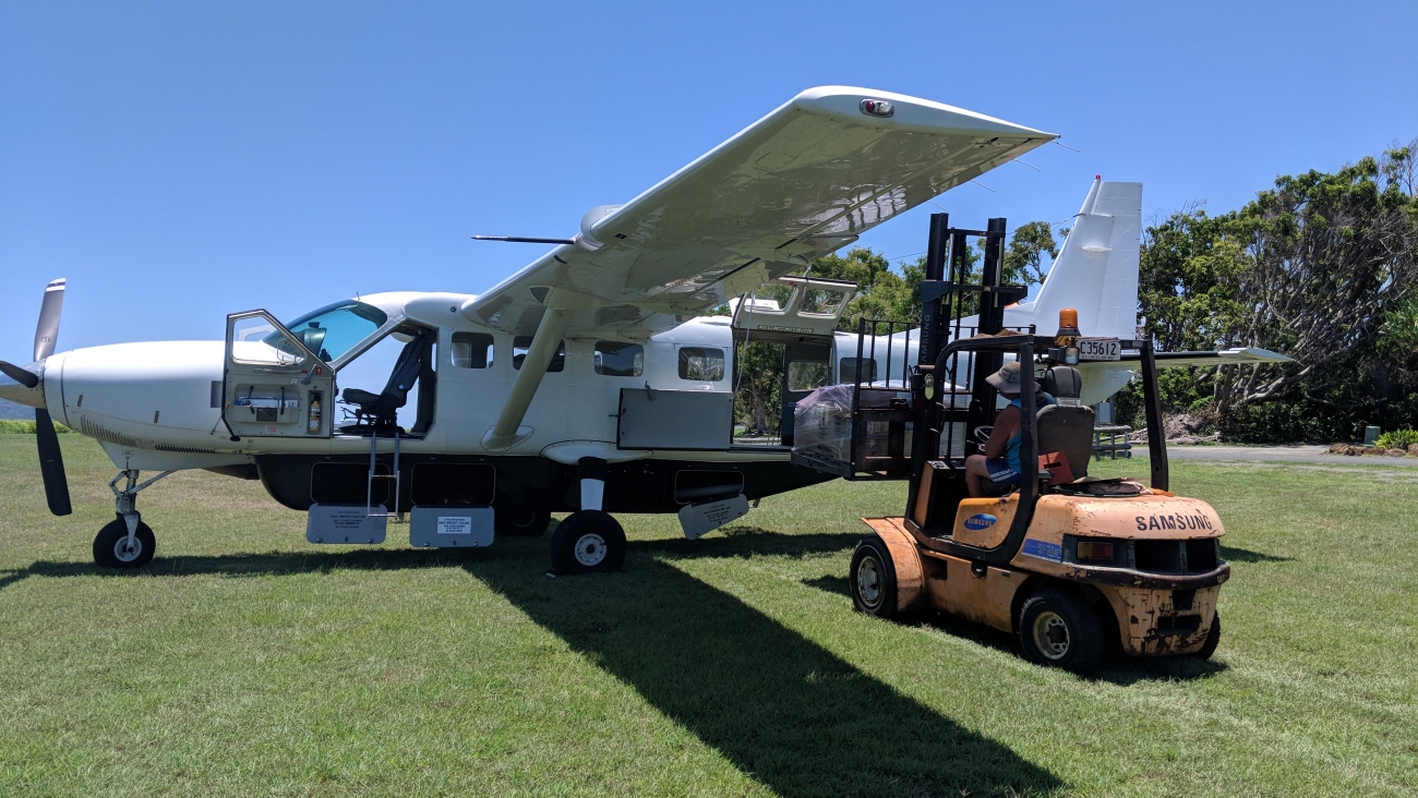 Cessna Caravan airfcraft loading freight on charter from Cairns