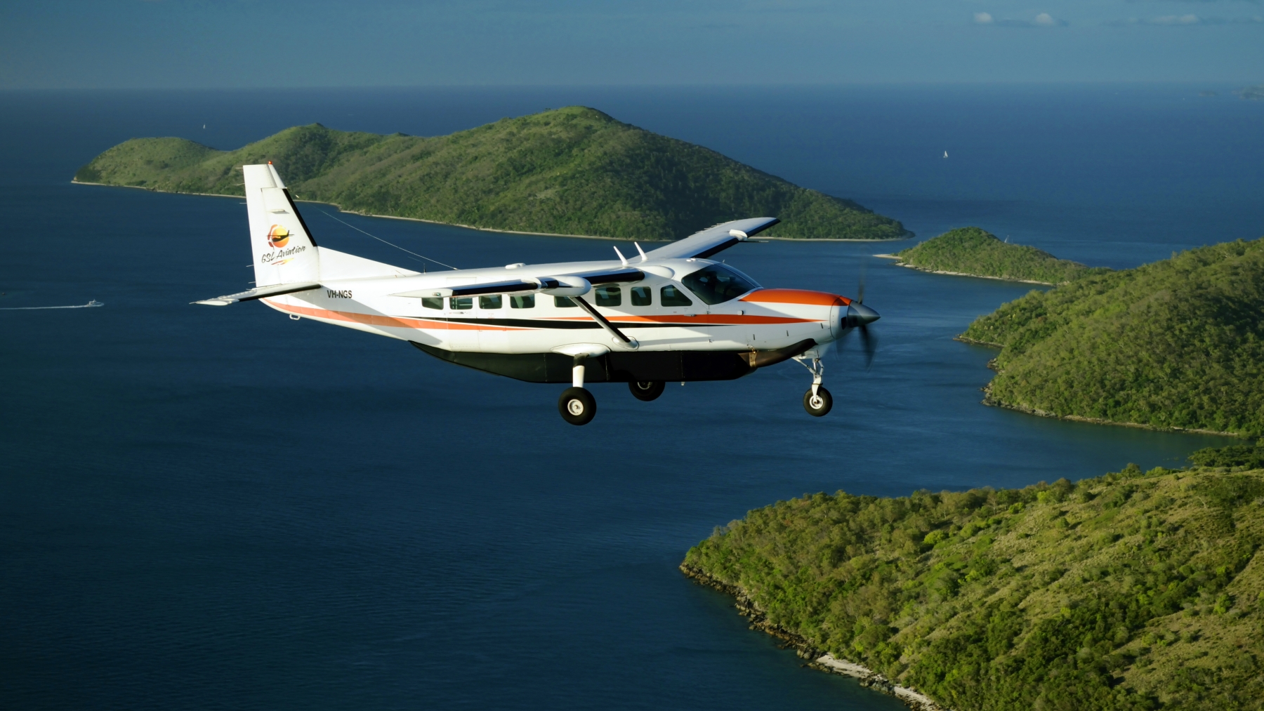 Cessna Grand Caravan in flight over the Whitsundays on charter with GSL Aviation